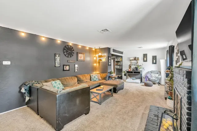 a living room with table and a window