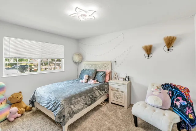 a living room with furniture and flat screen tv