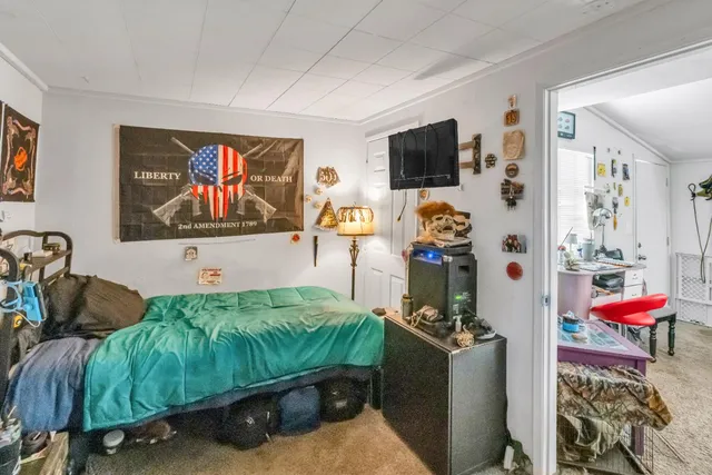 a bathroom with a sink and mirror with window