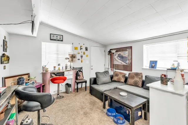 a kitchen with a stove a sink and a refrigerator