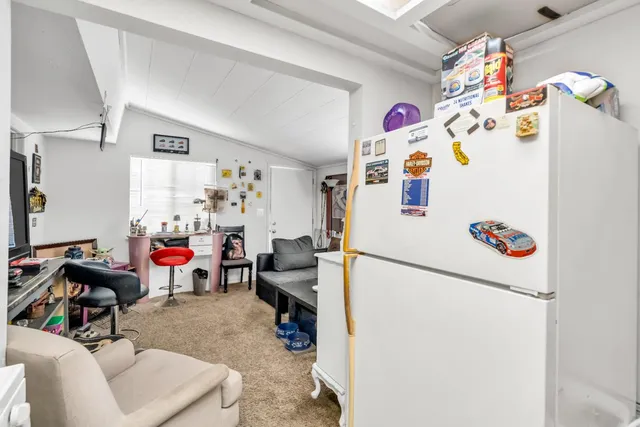 an aerial view of a house with yard swimming pool and outdoor seating