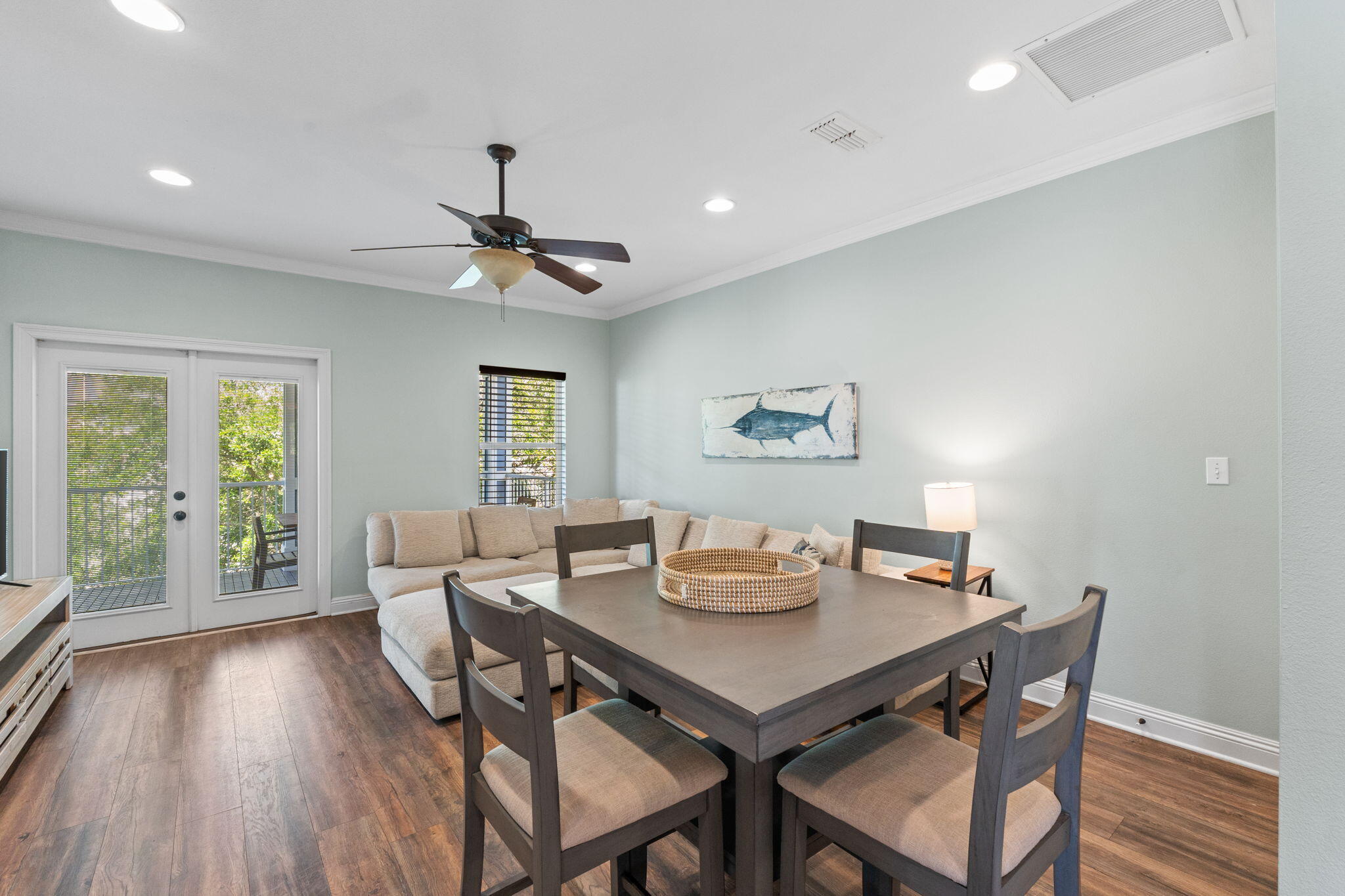 209 Grand Key Loop East Destin, FL 32541 - Photo 34 of 59 a view of a dining room with furniture window and wooden floor