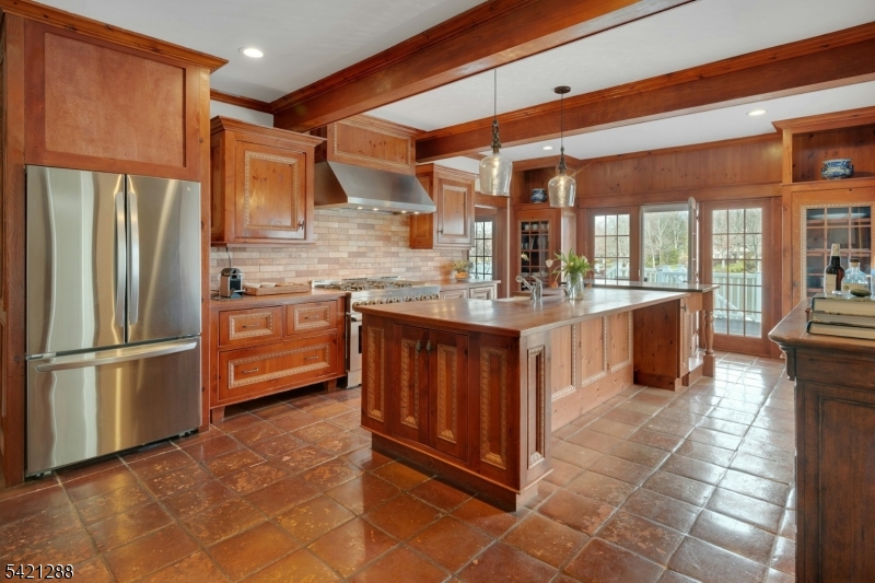 17 Briarcliff Road Mountain Lakes, NJ 07046 - Photo 19 of 50 a kitchen with stainless steel appliances granite countertop a refrigerator and a stove