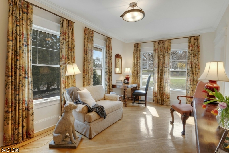 17 Briarcliff Road Mountain Lakes, NJ 07046 - Photo 22 of 50 a living room with furniture and a floor to ceiling window