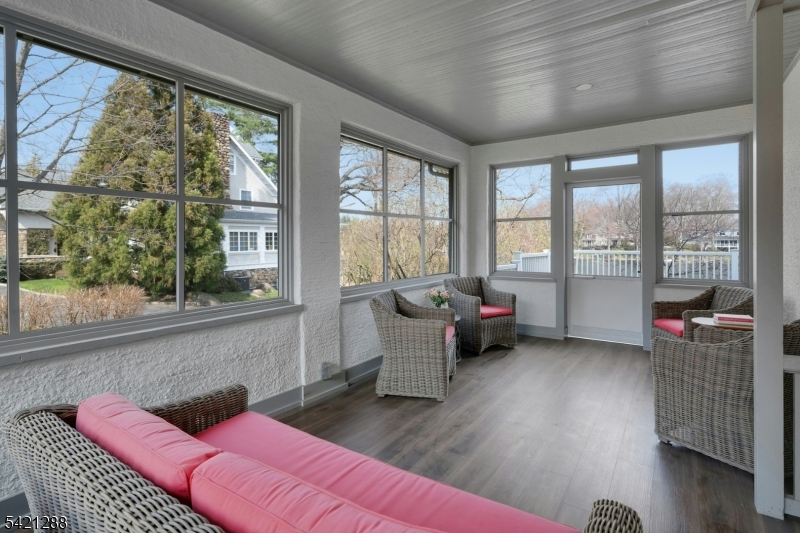 17 Briarcliff Road Mountain Lakes, NJ 07046 - Photo 24 of 50 a living room with furniture and a floor to ceiling window