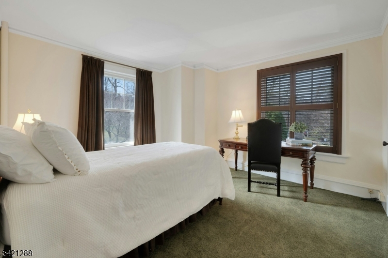 17 Briarcliff Road Mountain Lakes, NJ 07046 - Photo 33 of 50 a bedroom with a bed chair and a window