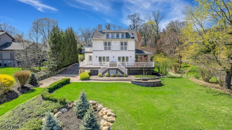 17 Briarcliff Road Mountain Lakes, NJ 07046 - Photo 6 of 50 a view of a house with a big yard and large trees