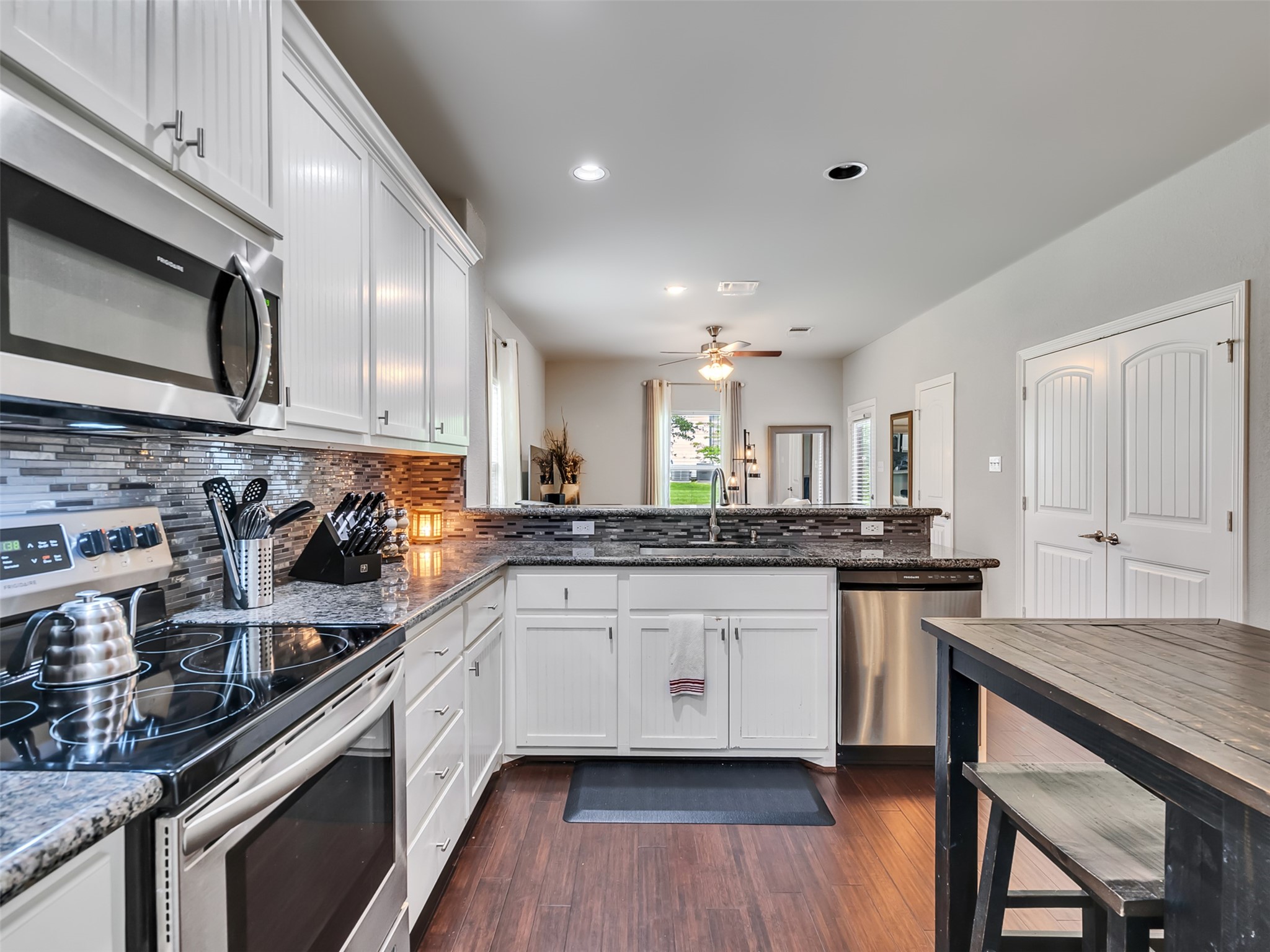 278 Capetown Montgomery, TX 77356 - Photo 12 of 27 a kitchen with stainless steel appliances a sink stove and cabinets