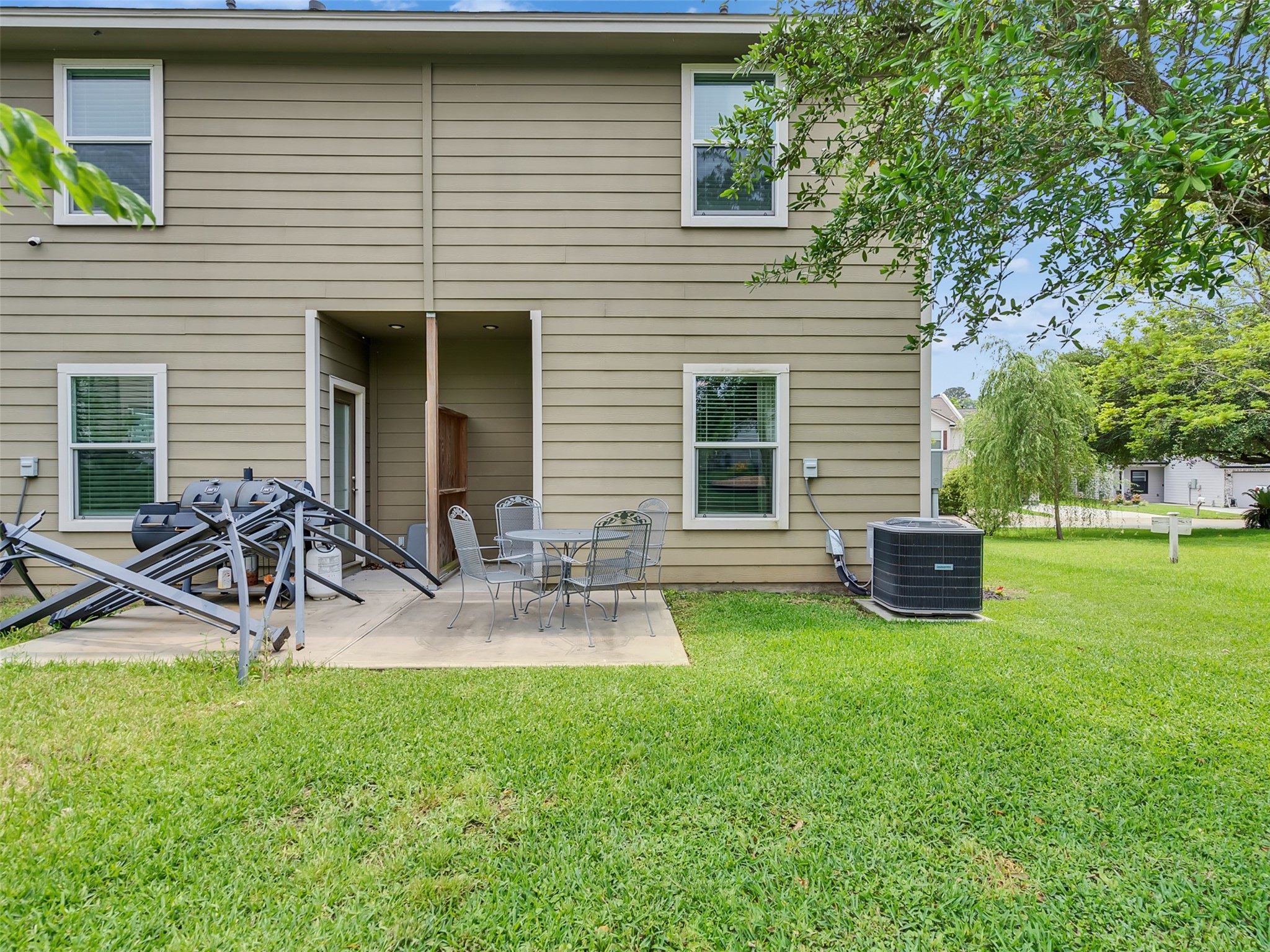 278 Capetown Montgomery, TX 77356 - Photo 22 of 27 a view of a backyard with table and chairs