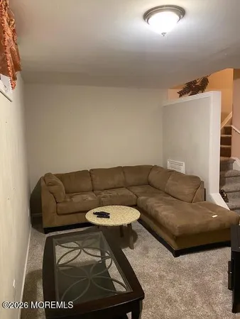 a living room with furniture and a couch
