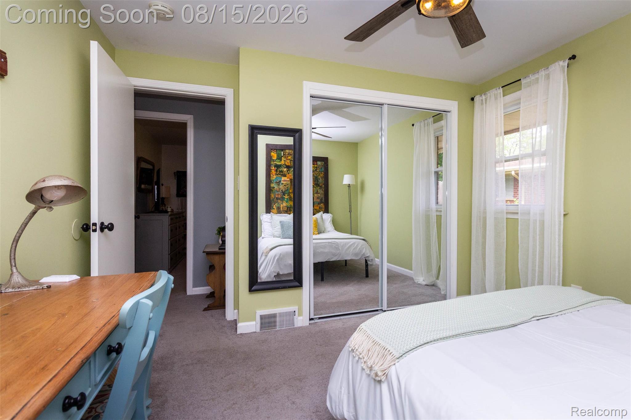 29604 Chelmsford Road Southfield, MI 48076 - Photo 23 of 39 Room featuring a ceiling fan, sliding mirrored closet doors, and light-toned walls