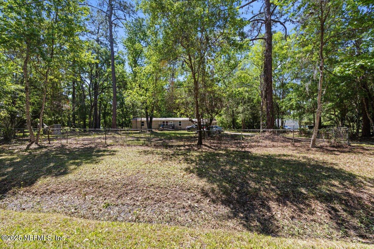 798 Worth Road St. Johns, FL 32259 - Photo 1 of 13 a backyard of a house with lots of green space