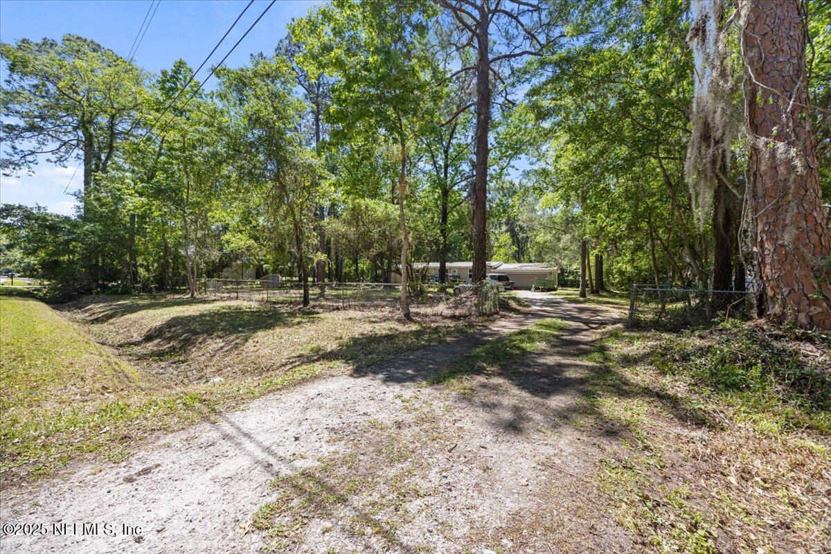 798 Worth Road St. Johns, FL 32259 - Photo 3 of 13 a backyard of a house with lots of green space