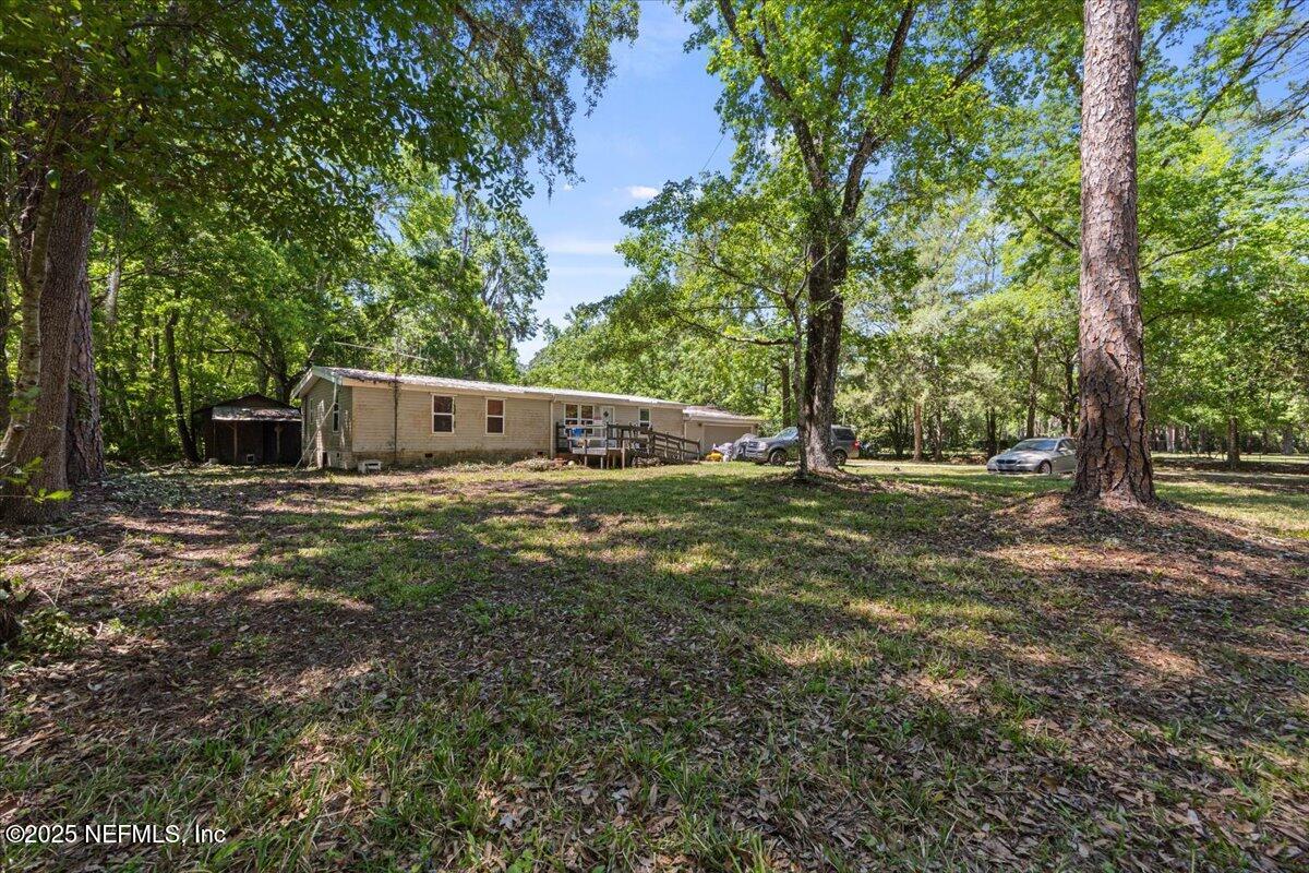 798 Worth Road St. Johns, FL 32259 - Photo 4 of 13 a backyard of a house with lots of green space