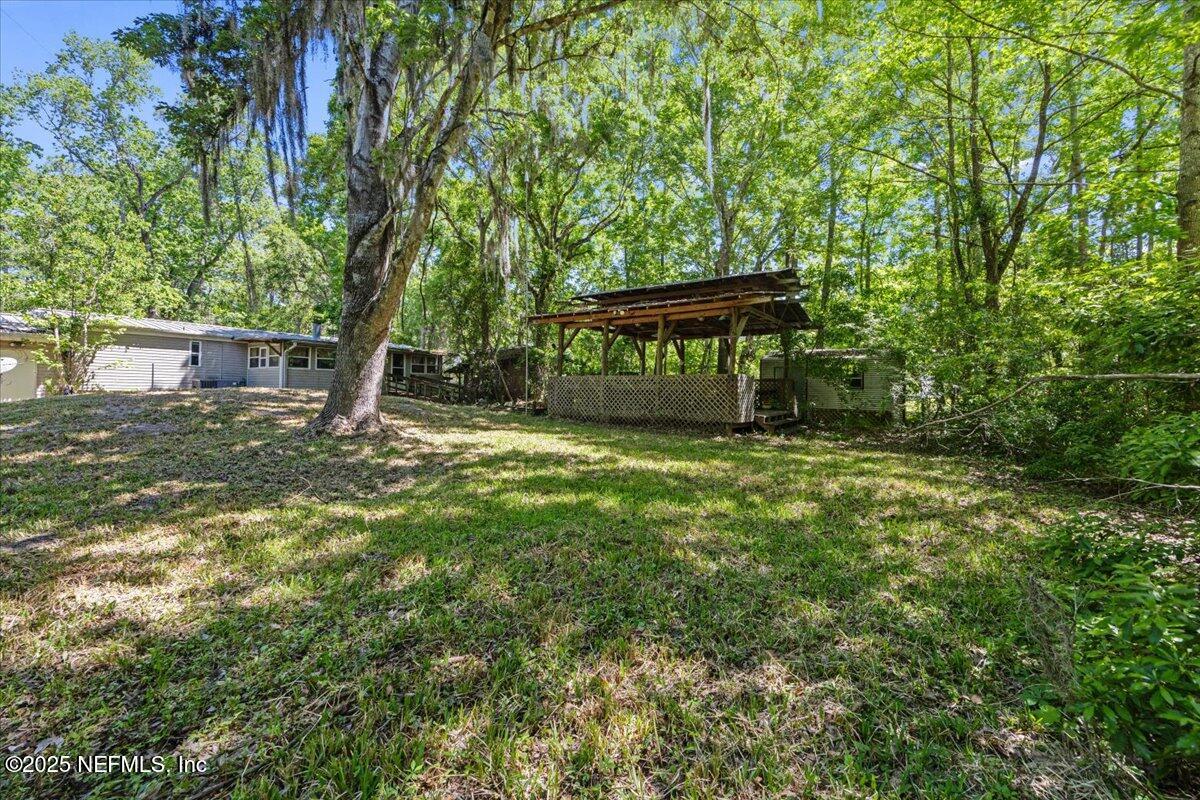 798 Worth Road St. Johns, FL 32259 - Photo 7 of 13 a front view of a house with garden