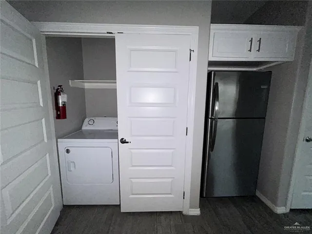 a kitchen with a sink stove and microwave