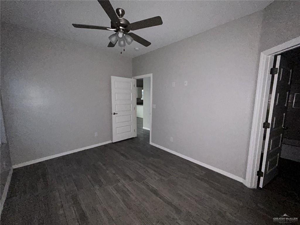 1905 Stauffer Street, Unit 4 Weslaco, TX 78596 - Photo 6 of 13 wooden floor in an empty room