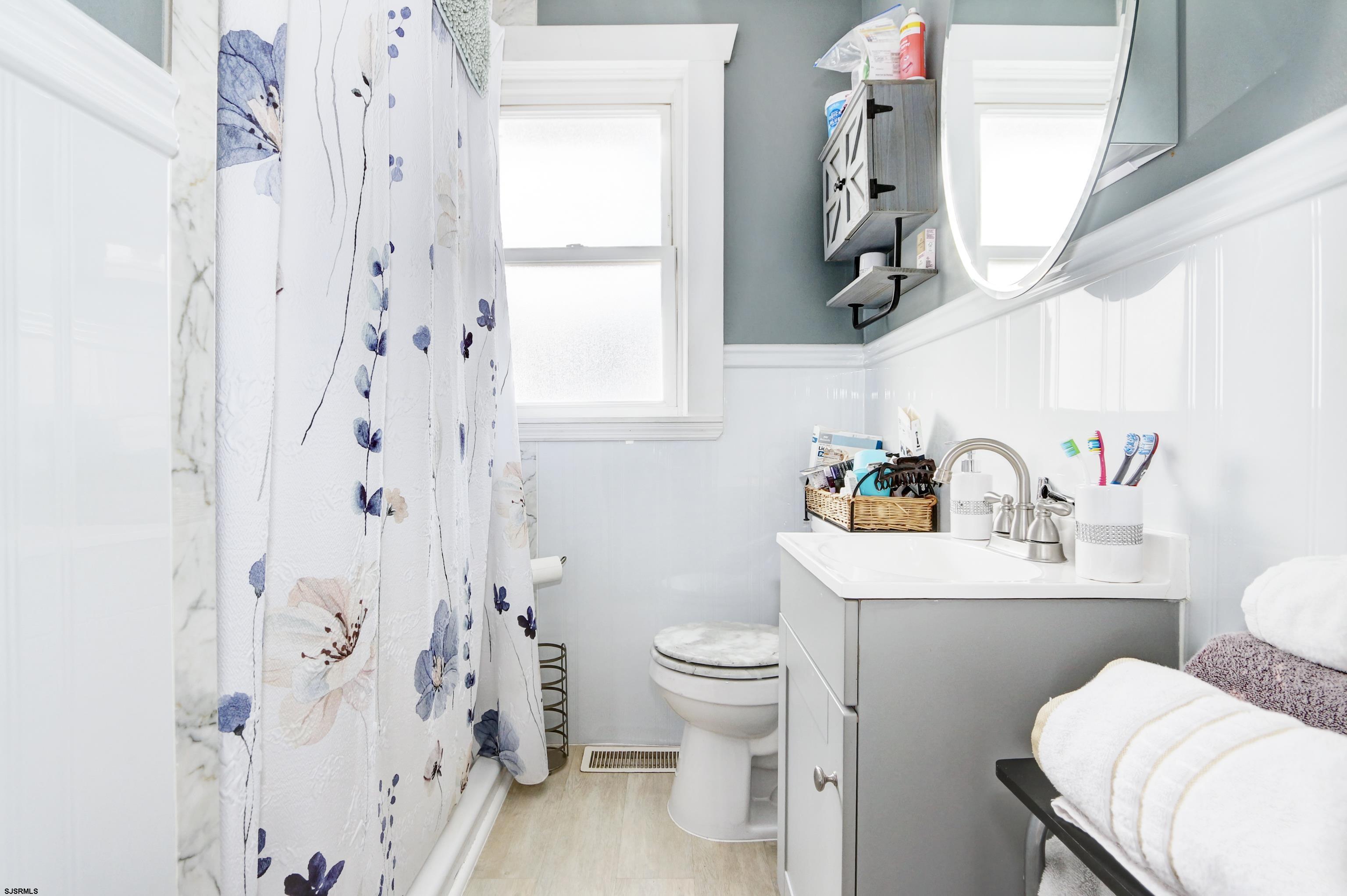215 West Connecticut Avenue Somers Point, NJ 08244 - Photo 15 of 35 a bathroom with a sink toilet tub and shower