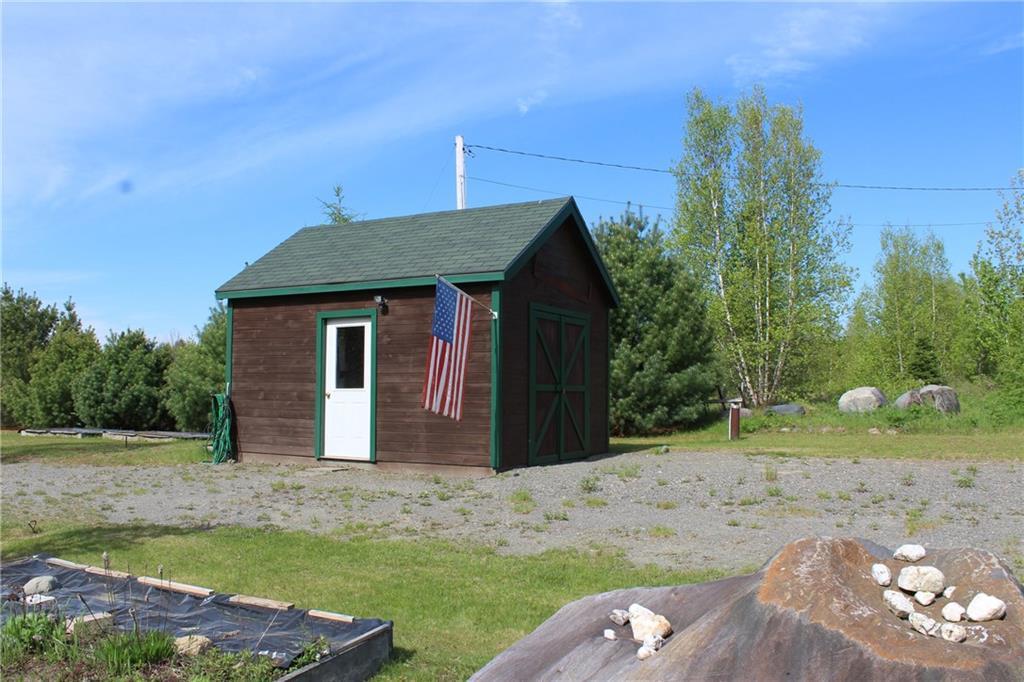 69 Sunrise Ridge Road Milo, ME 04463 - Photo 3 of 10 small shed houses the electric...