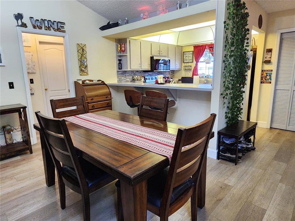 1701 Southeast 24th Road, Unit 1601 Ocala, FL 34471 - Photo 6 of 30 a room with a table chairs and a workspace