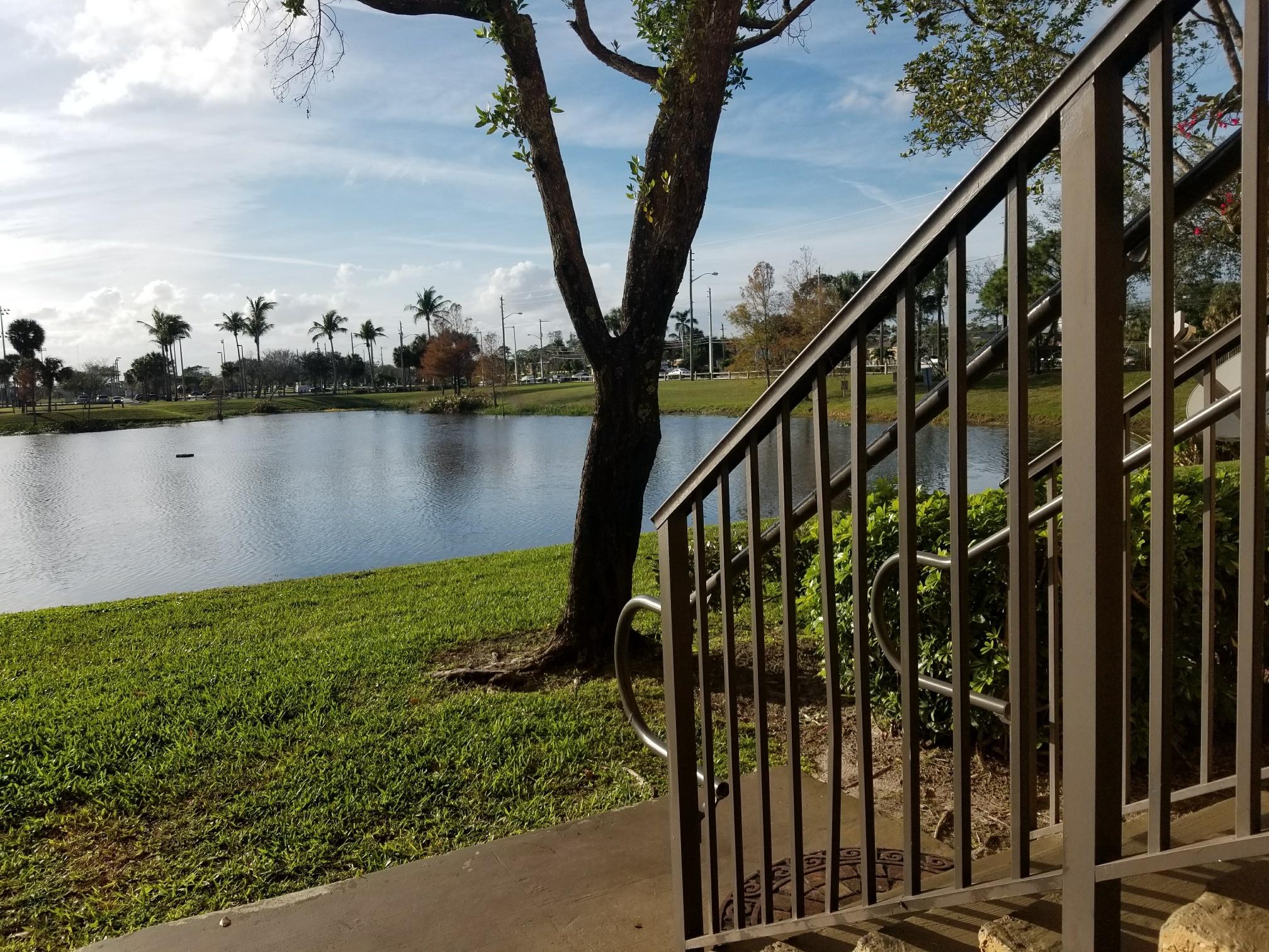 5064 Lantana Road, Unit 6107 Lake Worth, FL 33463 - Photo 1 of 26 a view of a balcony with lake