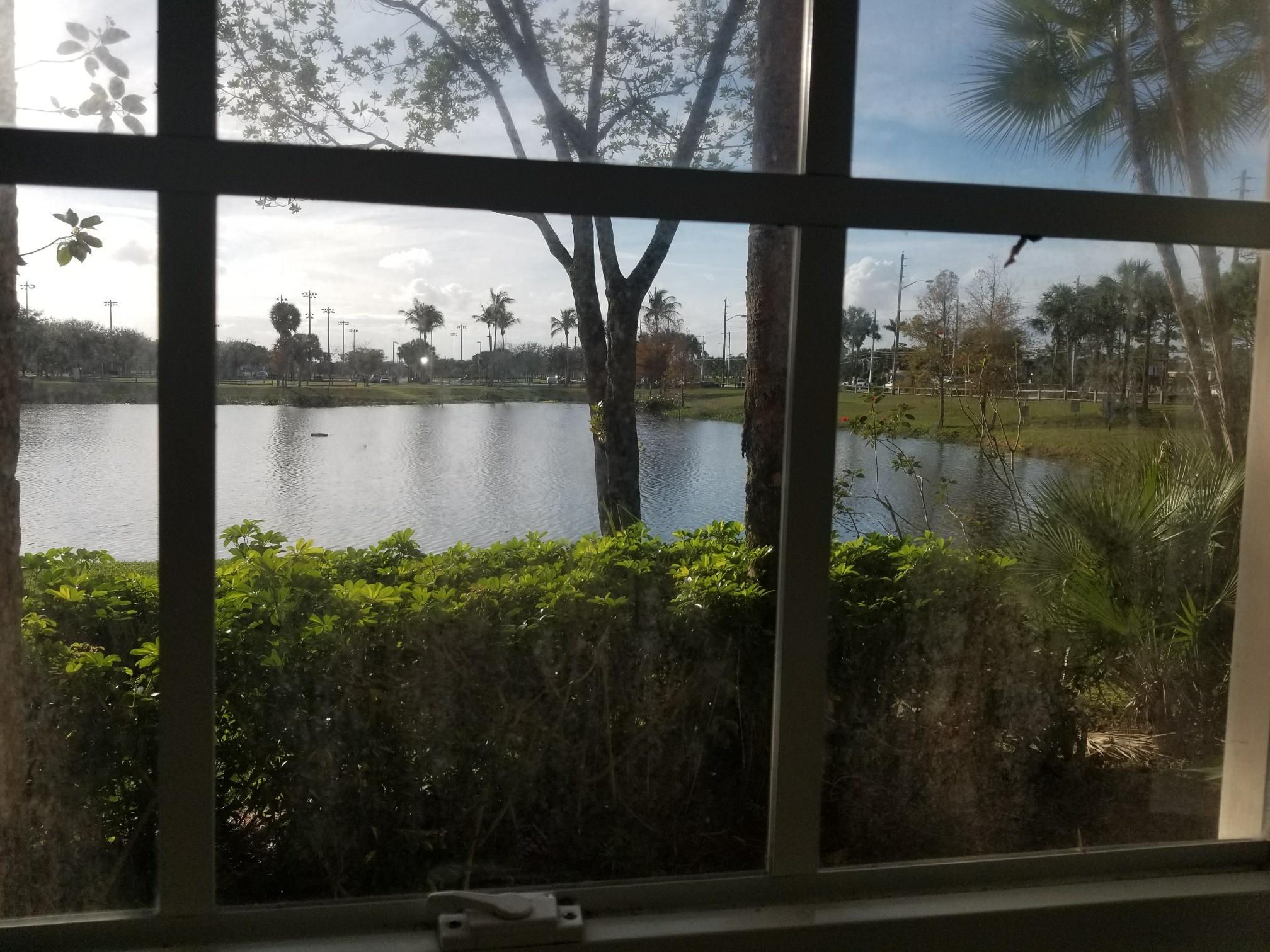 5064 Lantana Road, Unit 6107 Lake Worth, FL 33463 - Photo 12 of 26 a view of lake from a window