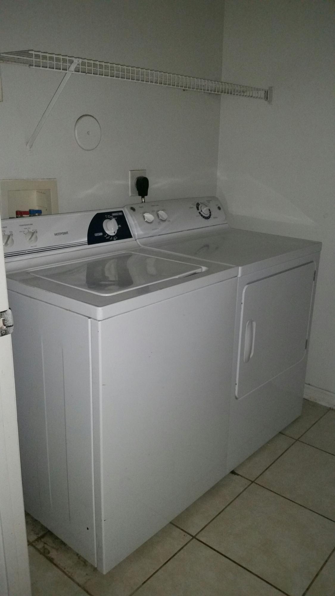 5064 Lantana Road, Unit 6107 Lake Worth, FL 33463 - Photo 16 of 26 a utility room with dryer and washer