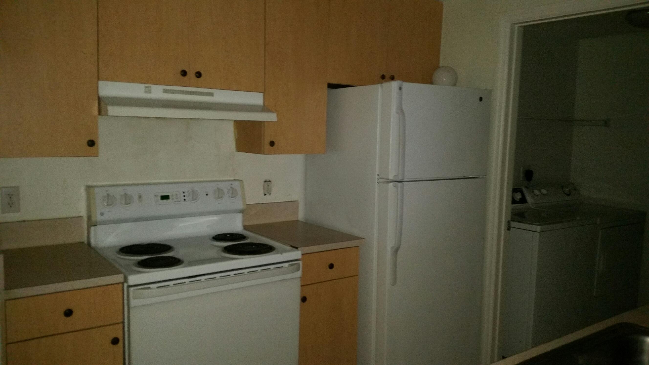 5064 Lantana Road, Unit 6107 Lake Worth, FL 33463 - Photo 18 of 26 a close view of a storage and utility room with dryer and washer