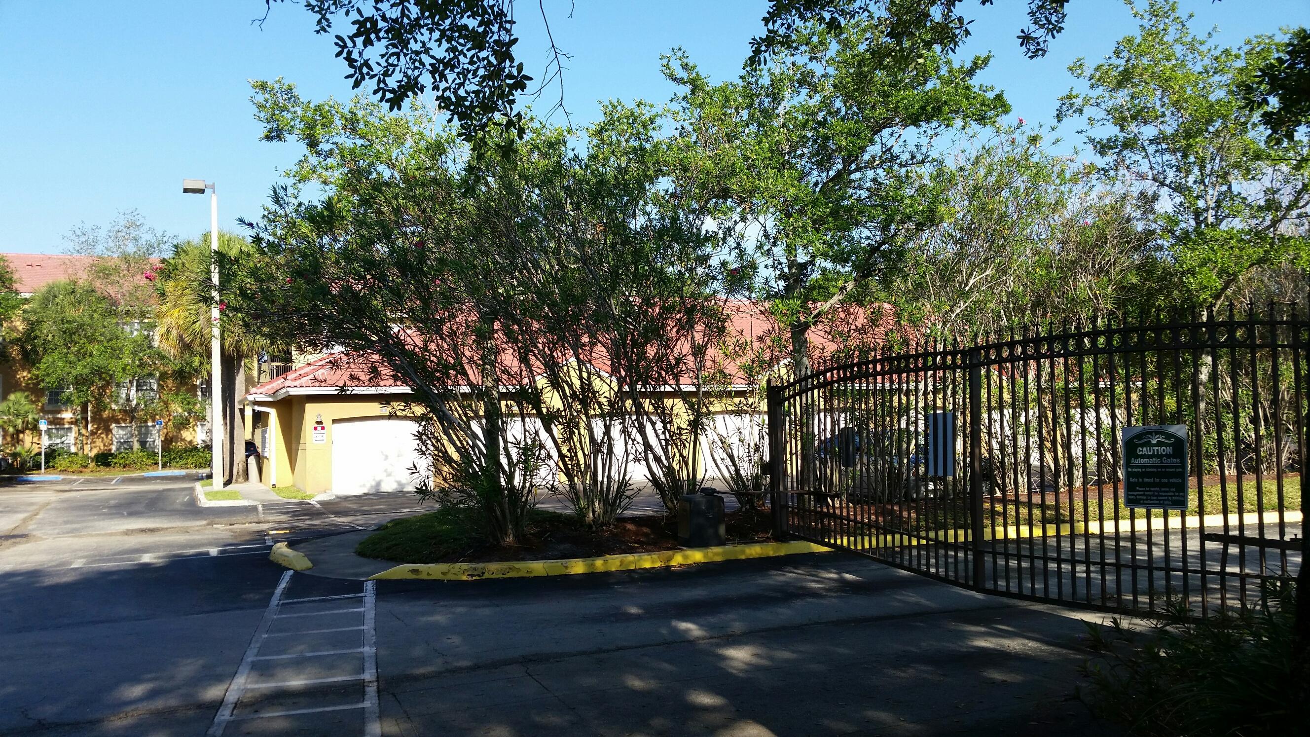 5064 Lantana Road, Unit 6107 Lake Worth, FL 33463 - Photo 21 of 26 a view of a yard with plants and trees