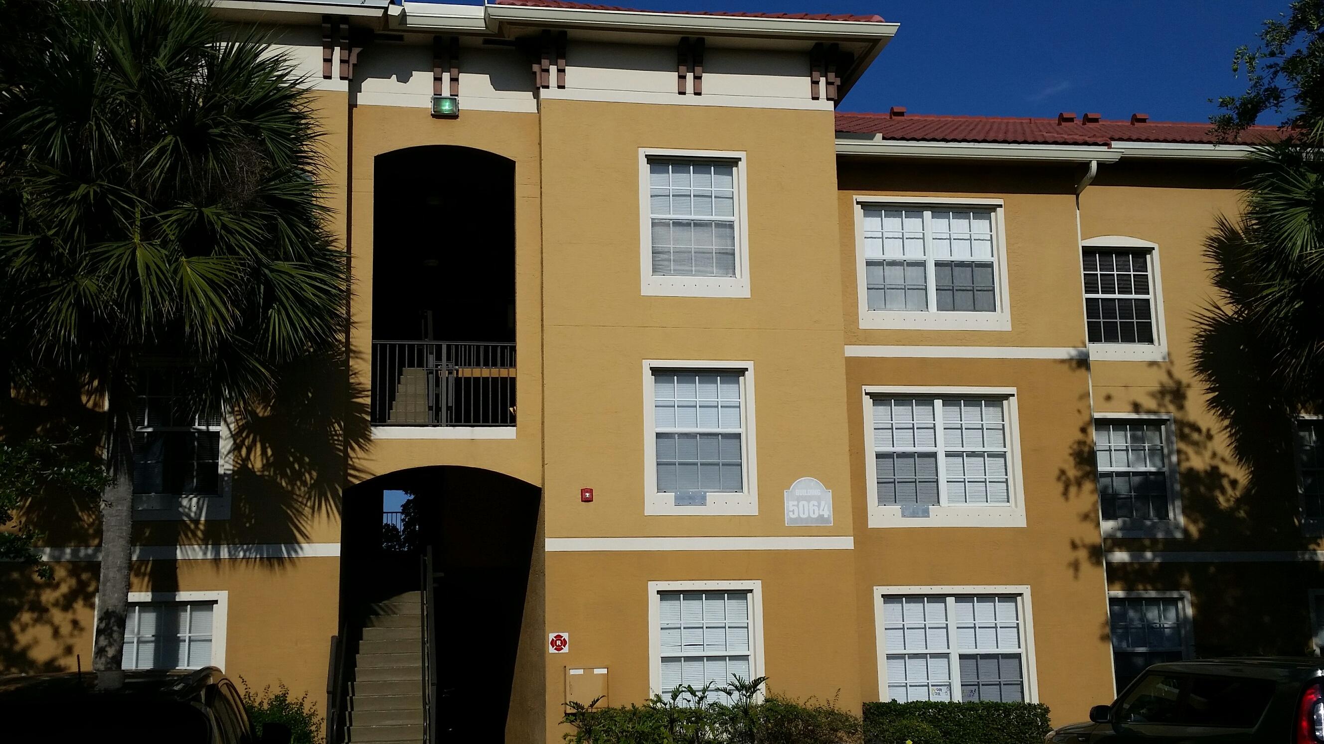 5064 Lantana Road, Unit 6107 Lake Worth, FL 33463 - Photo 23 of 26 a front view of a house with plants