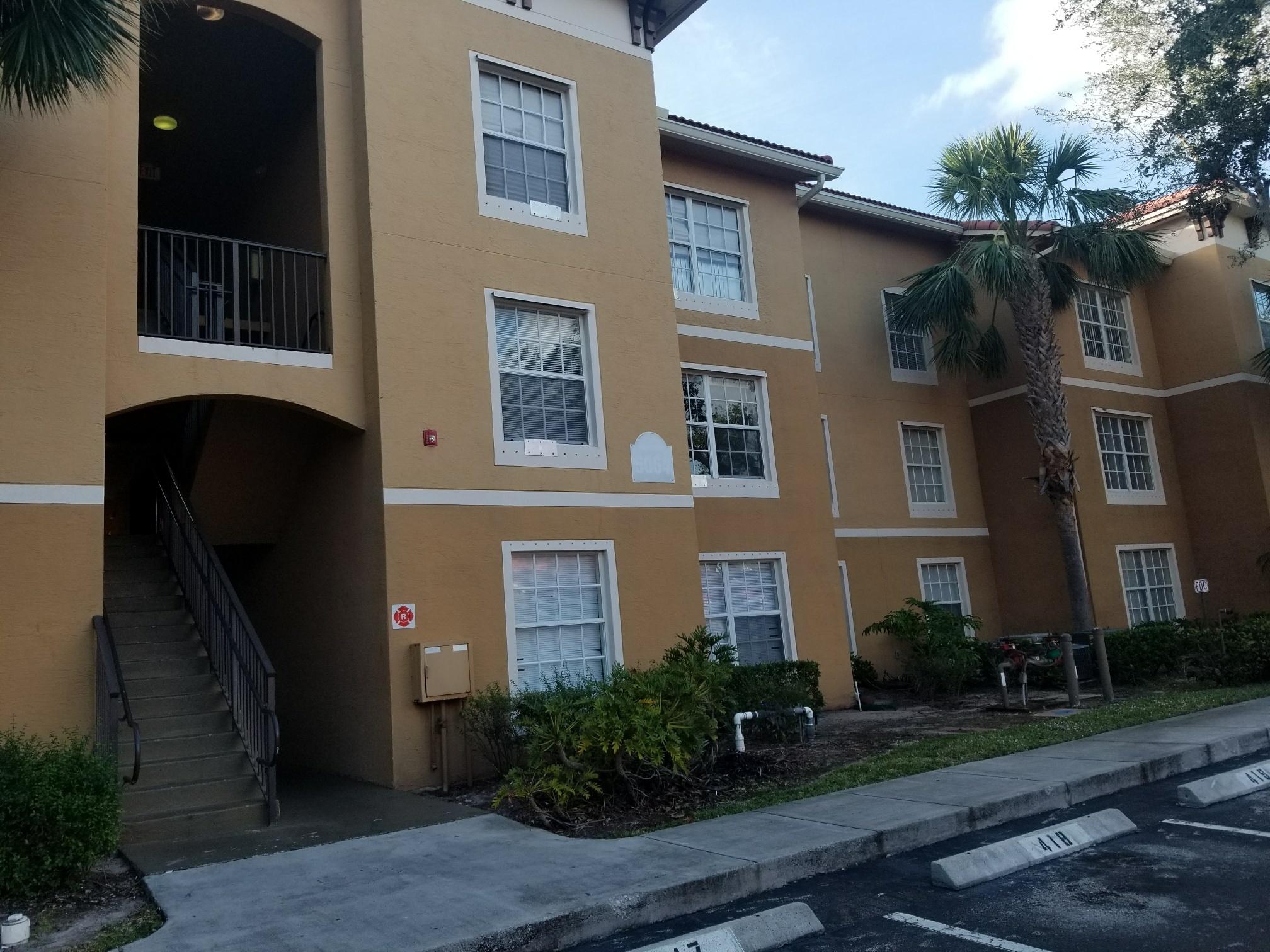 5064 Lantana Road, Unit 6107 Lake Worth, FL 33463 - Photo 3 of 26 a front view of a house with a yard