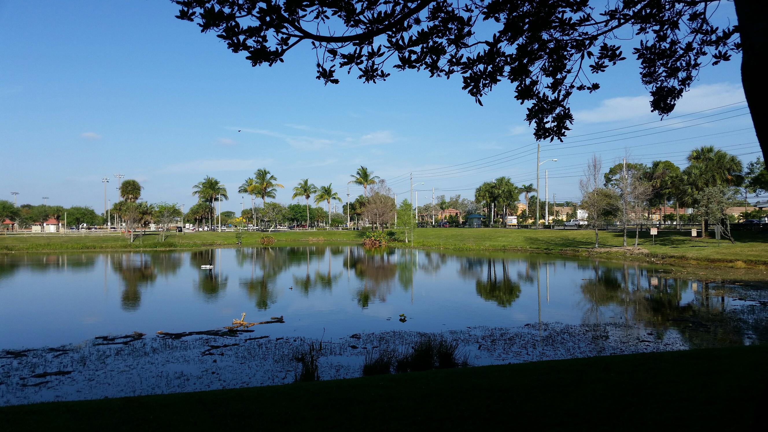 5064 Lantana Road, Unit 6107 Lake Worth, FL 33463 - Photo 5 of 26 a view of a lake with a house in the background