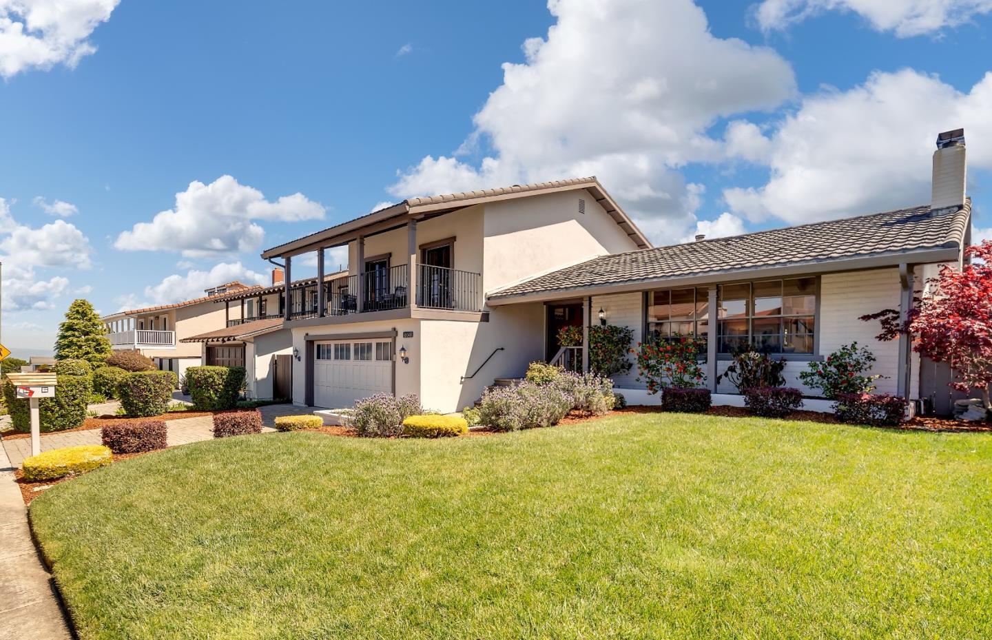 a front view of a house with swimming pool and porch