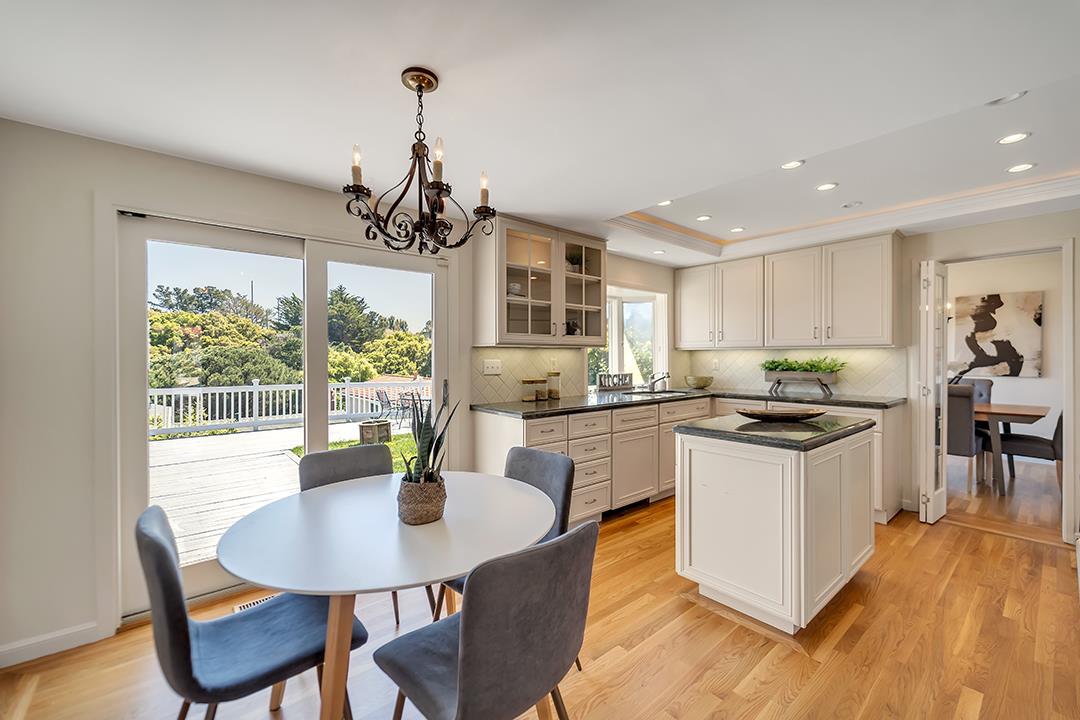 1049 Springfield Drive Millbrae, CA 94030 - Photo 12 of 51 a kitchen that has a table and chairs in it