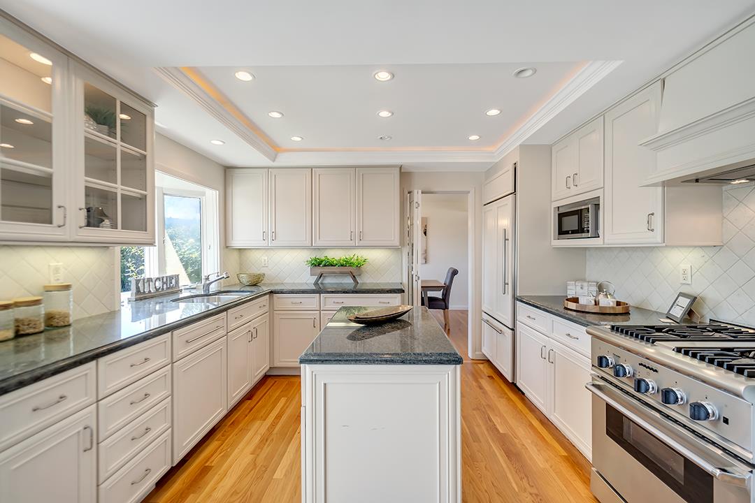 1049 Springfield Drive Millbrae, CA 94030 - Photo 15 of 51 a large kitchen with stainless steel appliances granite countertop a stove a sink and a refrigerator