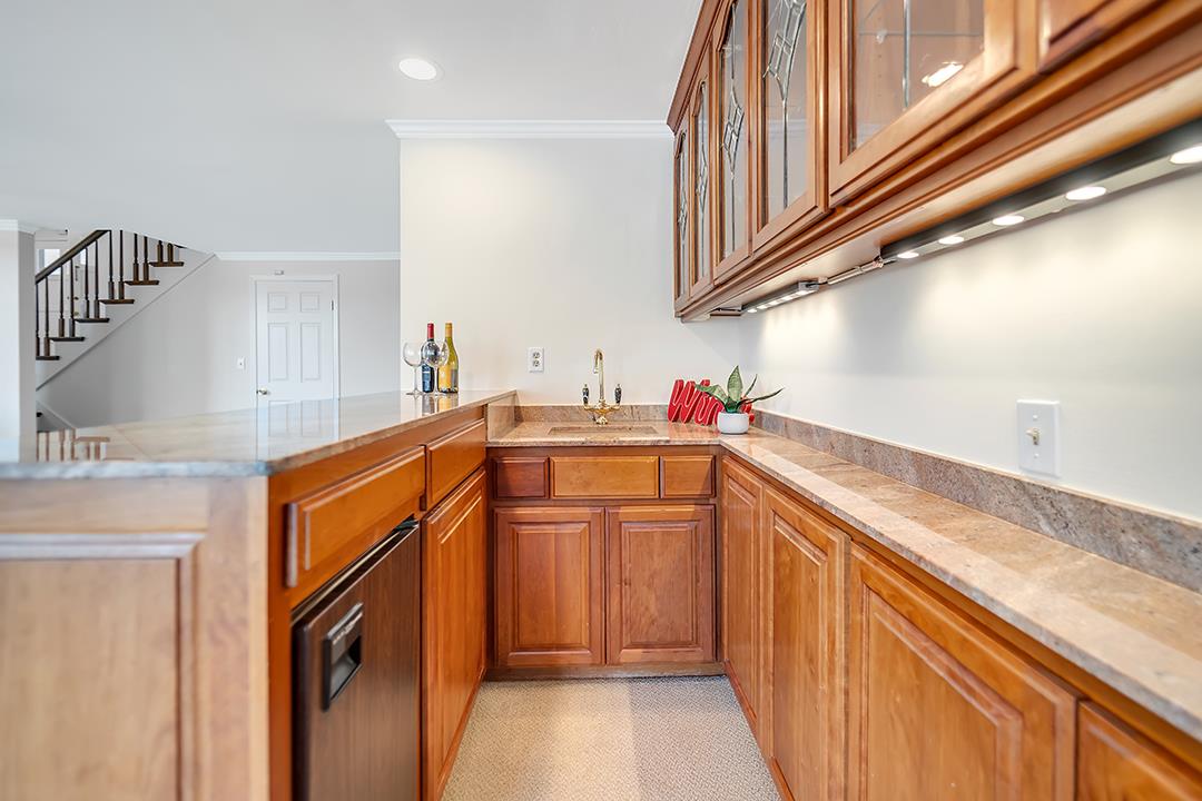 1049 Springfield Drive Millbrae, CA 94030 - Photo 25 of 51 a utility room with cabinets washer and dryer
