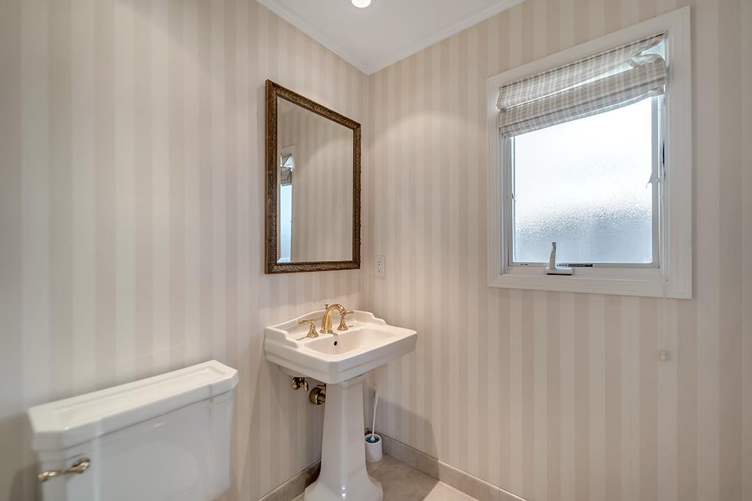 1049 Springfield Drive Millbrae, CA 94030 - Photo 26 of 51 a bathroom with a toilet sink and mirror
