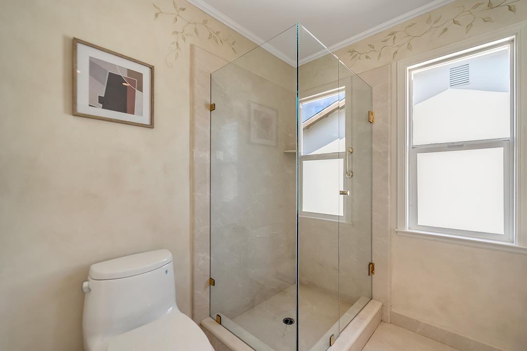 1049 Springfield Drive Millbrae, CA 94030 - Photo 30 of 51 a bathroom with a shower and a toilet