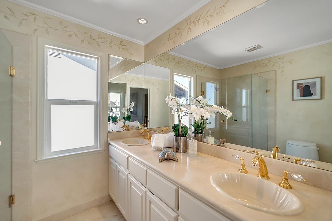 1049 Springfield Drive Millbrae, CA 94030 - Photo 39 of 51 a bathroom with a double vanity sink and a mirror