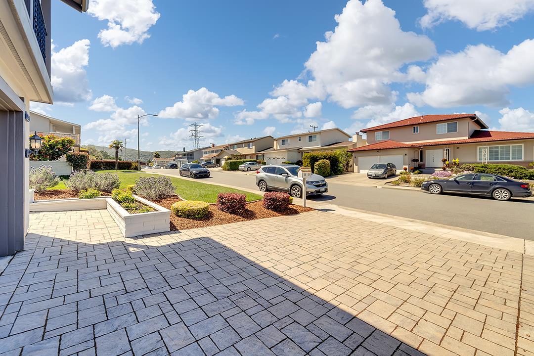 1049 Springfield Drive Millbrae, CA 94030 - Photo 4 of 51 a view of a yard with cars
