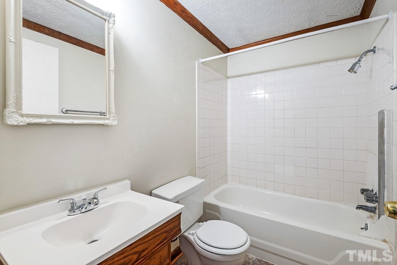 3014 Dearborn Drive Durham, NC 27704 - Photo 15 of 30 a bathroom with a sink toilet and shower