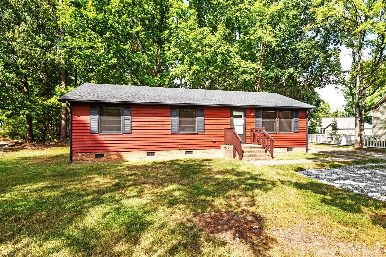 3014 Dearborn Drive Durham, NC 27704 - Photo 26 of 30 a backyard of a house with barbeque oven table and chairs