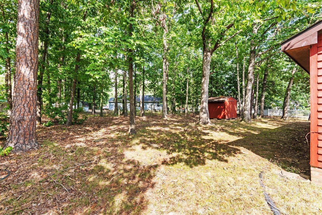 3014 Dearborn Drive Durham, NC 27704 - Photo 28 of 30 a backyard of a house with lots of green space