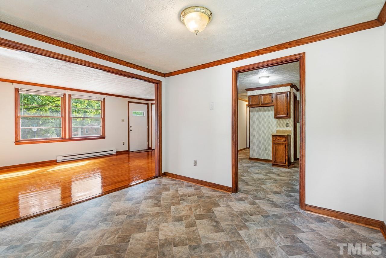 3014 Dearborn Drive Durham, NC 27704 - Photo 3 of 30 a view of an empty room with window and cabinet