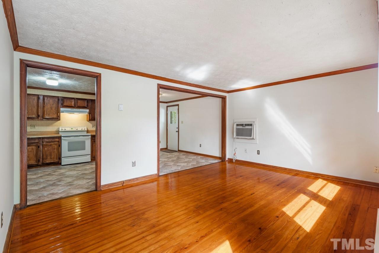 3014 Dearborn Drive Durham, NC 27704 - Photo 5 of 30 wooden floor in an empty room with a window