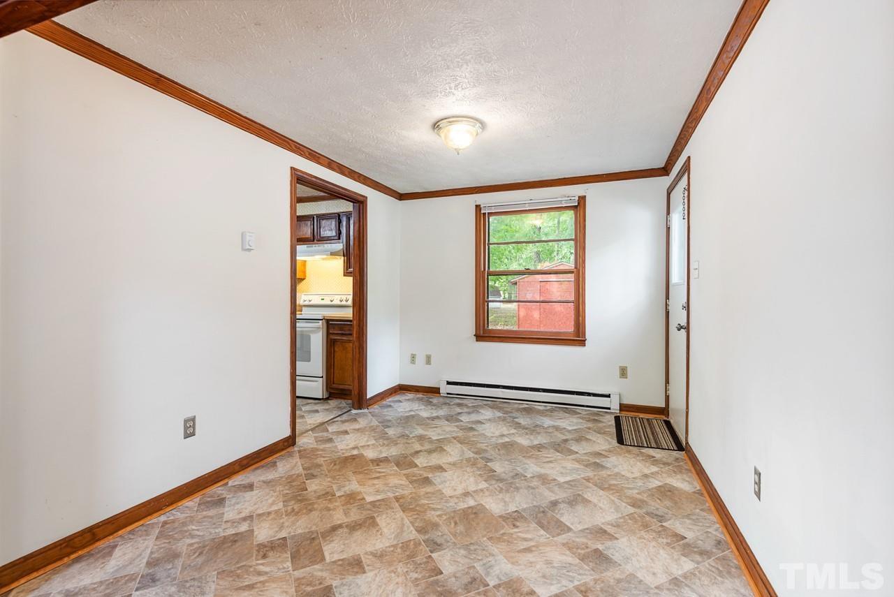 3014 Dearborn Drive Durham, NC 27704 - Photo 6 of 30 an empty room with windows
