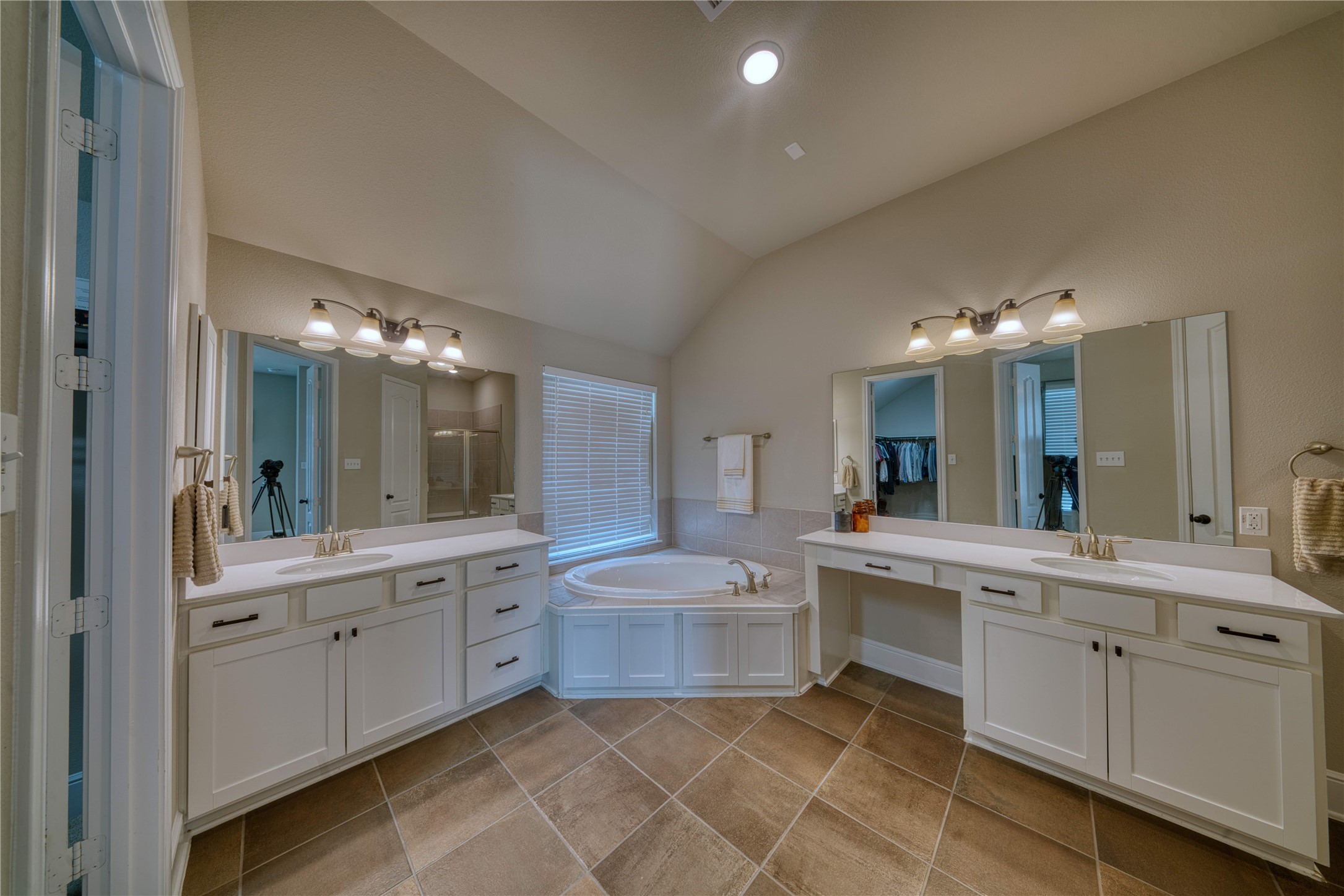 29311 Ribbongrass Court Katy, TX 77494 - Photo 3 of 21 a primary bathroom with double vanity, soaking tub, and separate shower.
