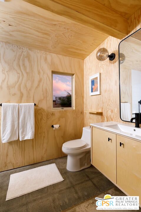 4619 Kickapoo Trail Landers, CA 92285 - Photo 31 of 55 a bathroom with a toilet sink and mirror