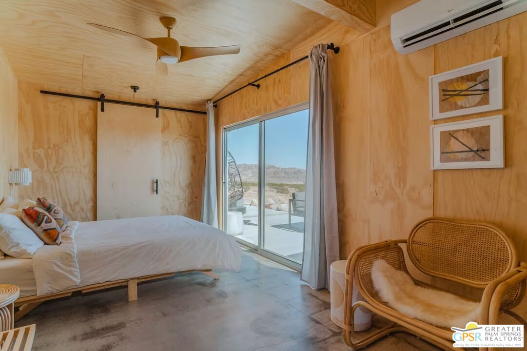 4619 Kickapoo Trail Landers, CA 92285 - Photo 32 of 55 a bedroom with a bed and wooden floor