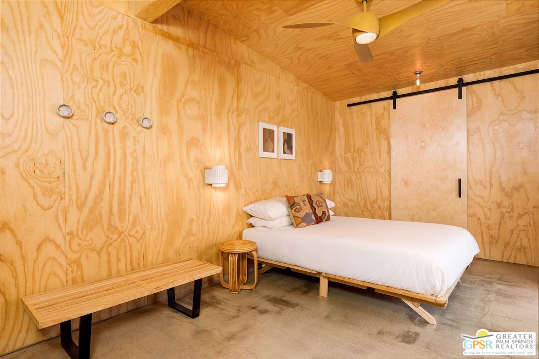 4619 Kickapoo Trail Landers, CA 92285 - Photo 37 of 55 a bedroom with a bed and a table in it